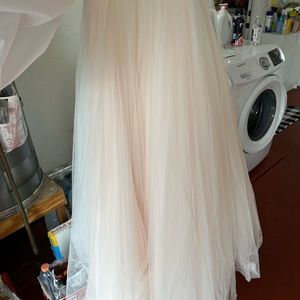 I believe it is a casa Blanca designer wedding dress. Size 14 never tailored